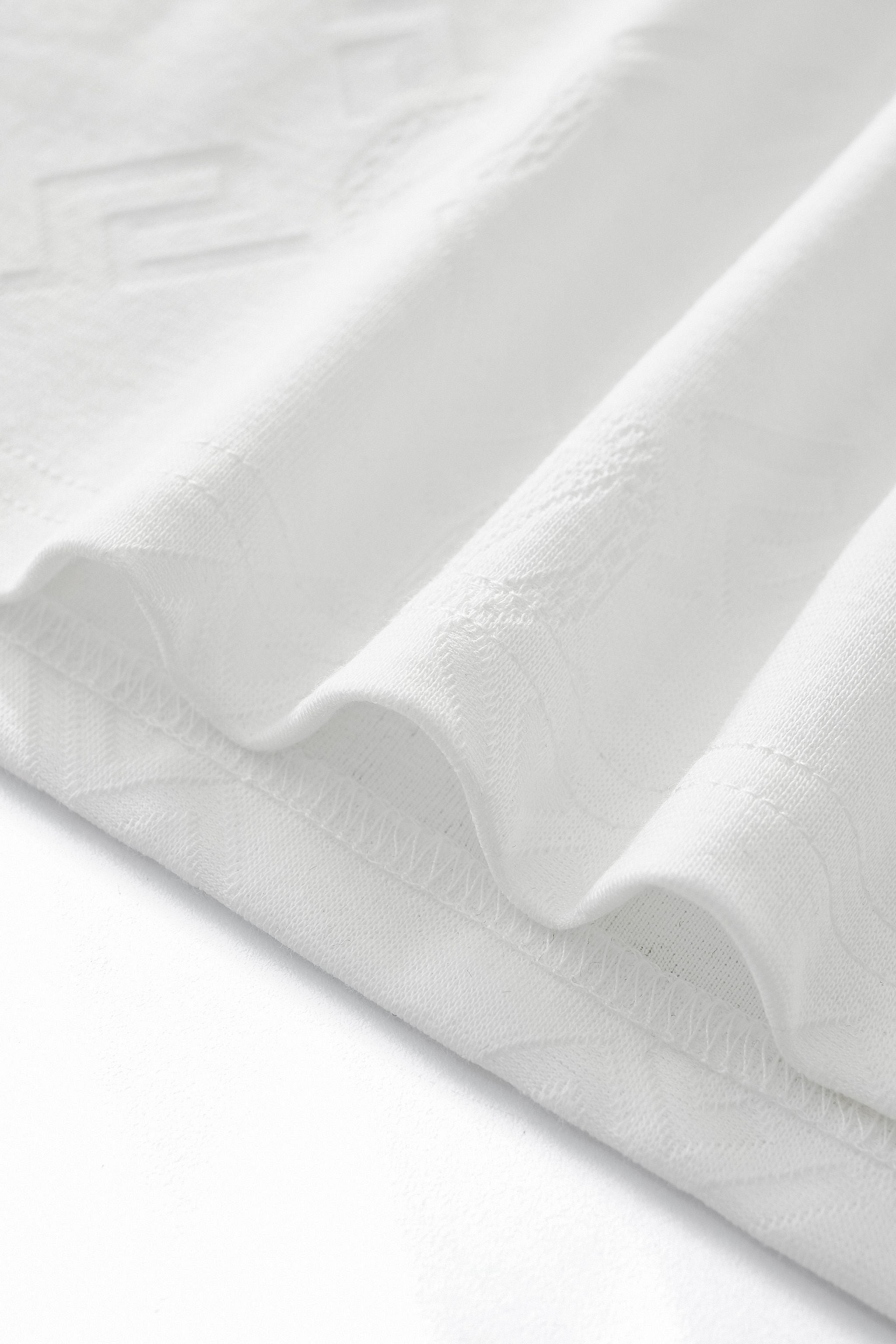 Embossed Monogram Tee – El Baron WHITE
