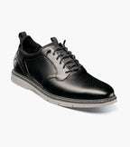Black leather shoe on a white background
